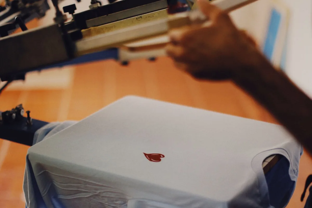 Screen printing a t-shirt at Teesgraphy